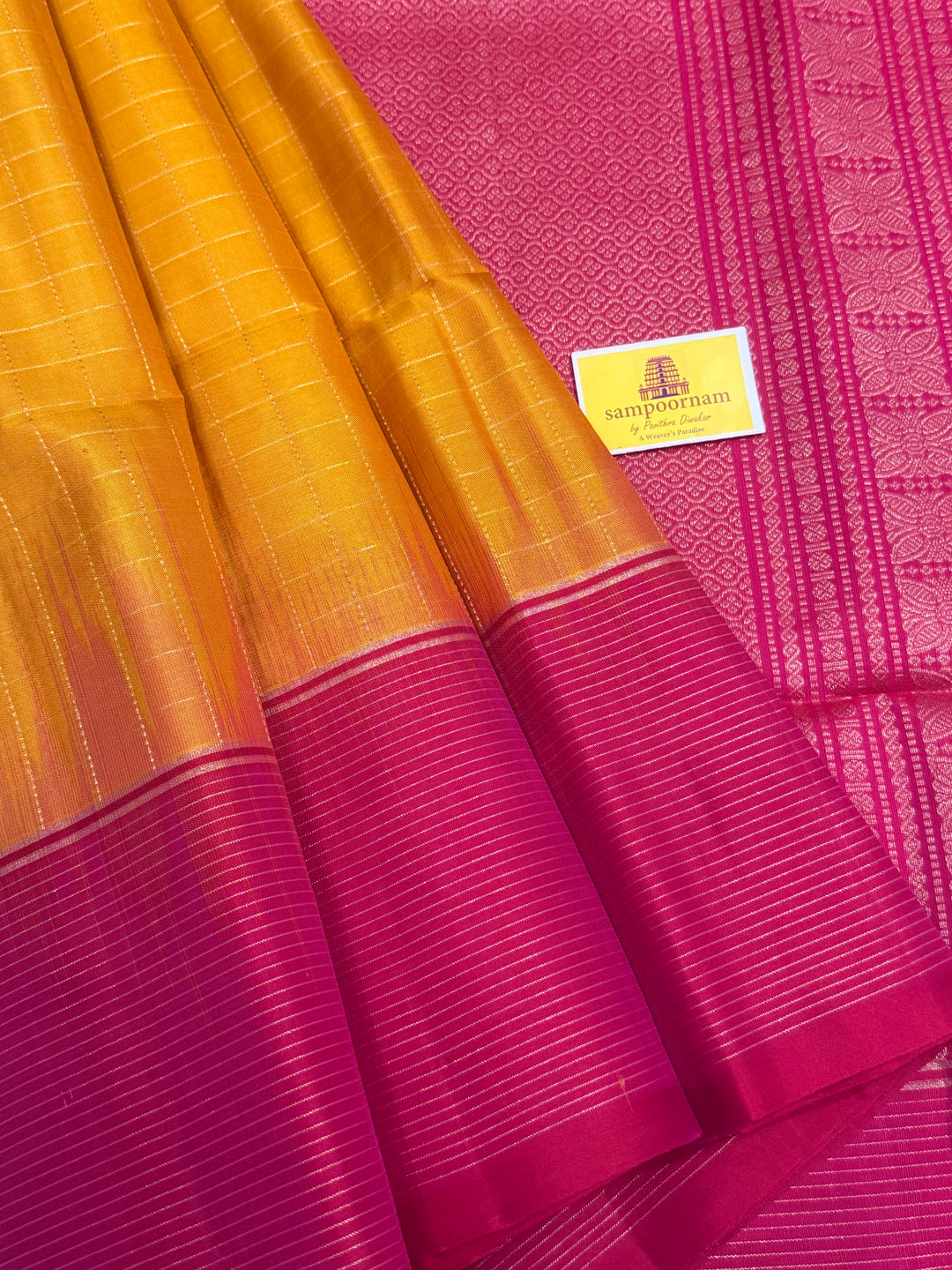 Manjal with Orangish Pink , rich zari annam and rudraksh butta in the body , plain borders and rich Pallu , pure soft silk saree