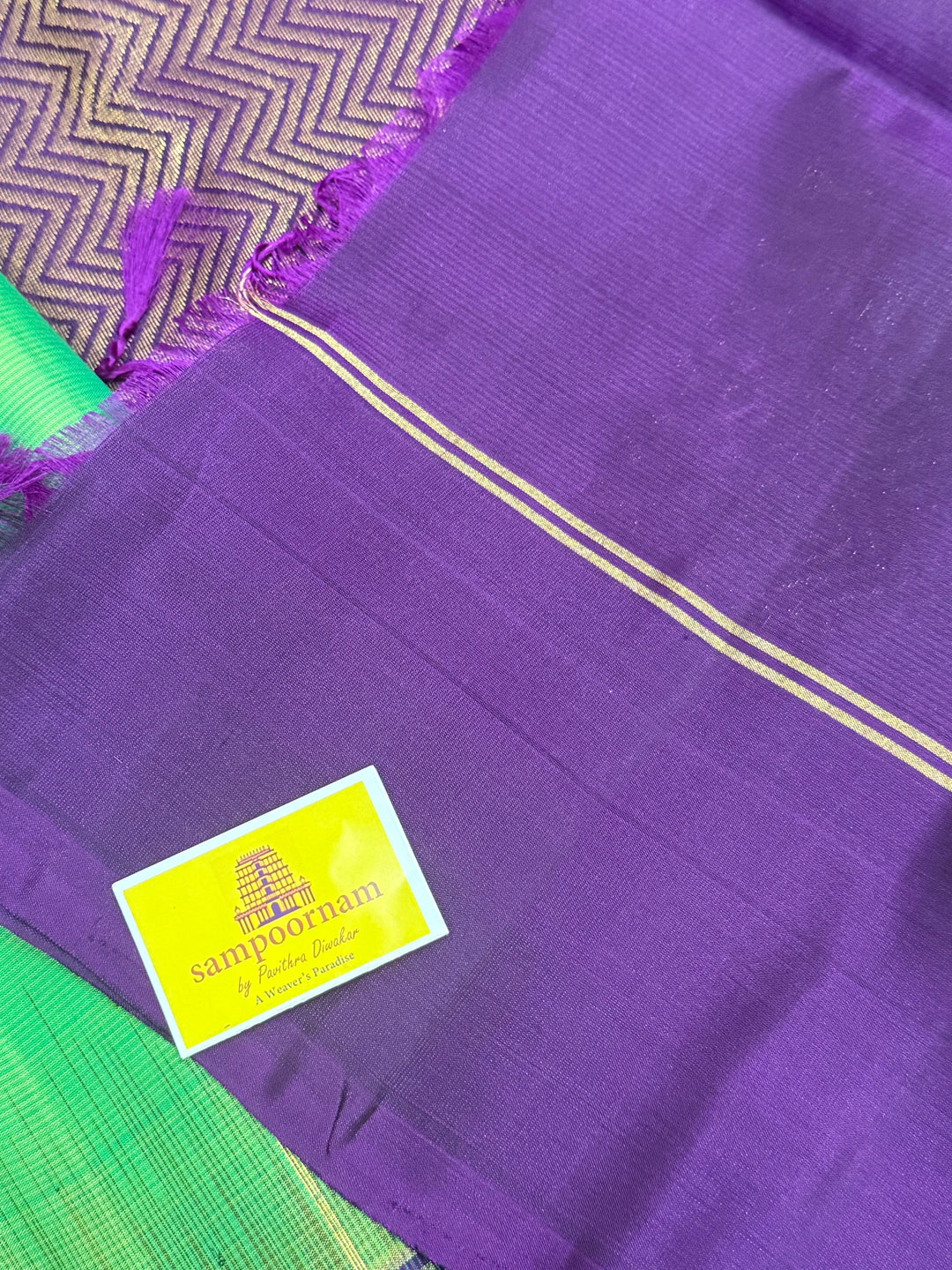 Parrot Green with purple , zari raindrop motif in the body , plain borders and rich Pallu , pure soft silk saree