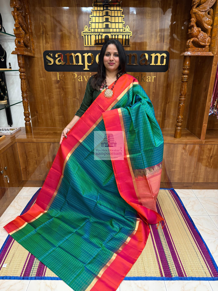 Ramar Green with Orangish Pink , Vairaoosi lines in the border ,  Zari butta in the body and grand  Pallu Pure Soft Silk Saree