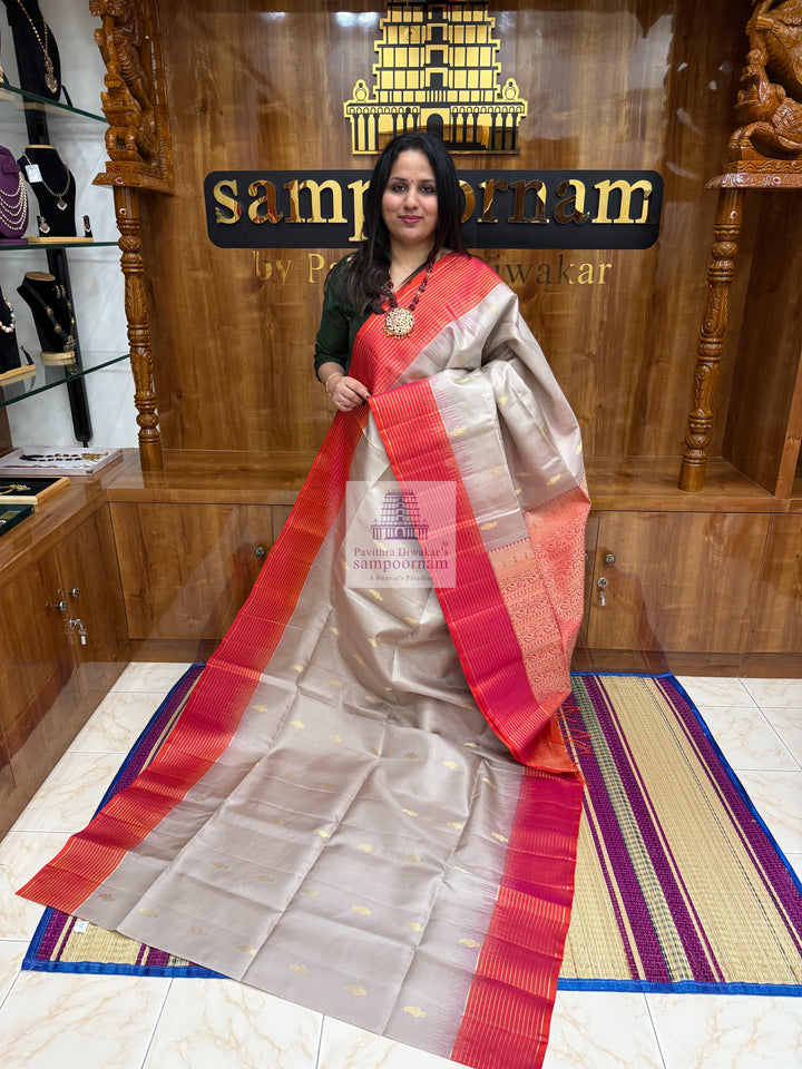 Beige with Orangish Pink , , Vairaoosi lines in the border , Mango  Zari butta in the body and grand  Pallu Pure Soft Silk Saree