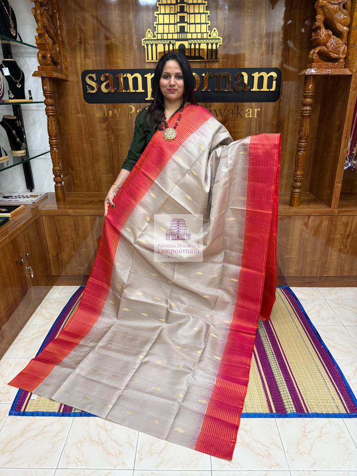Beige with Orangish Pink , , Vairaoosi lines in the border , Mango  Zari butta in the body and grand  Pallu Pure Soft Silk Saree