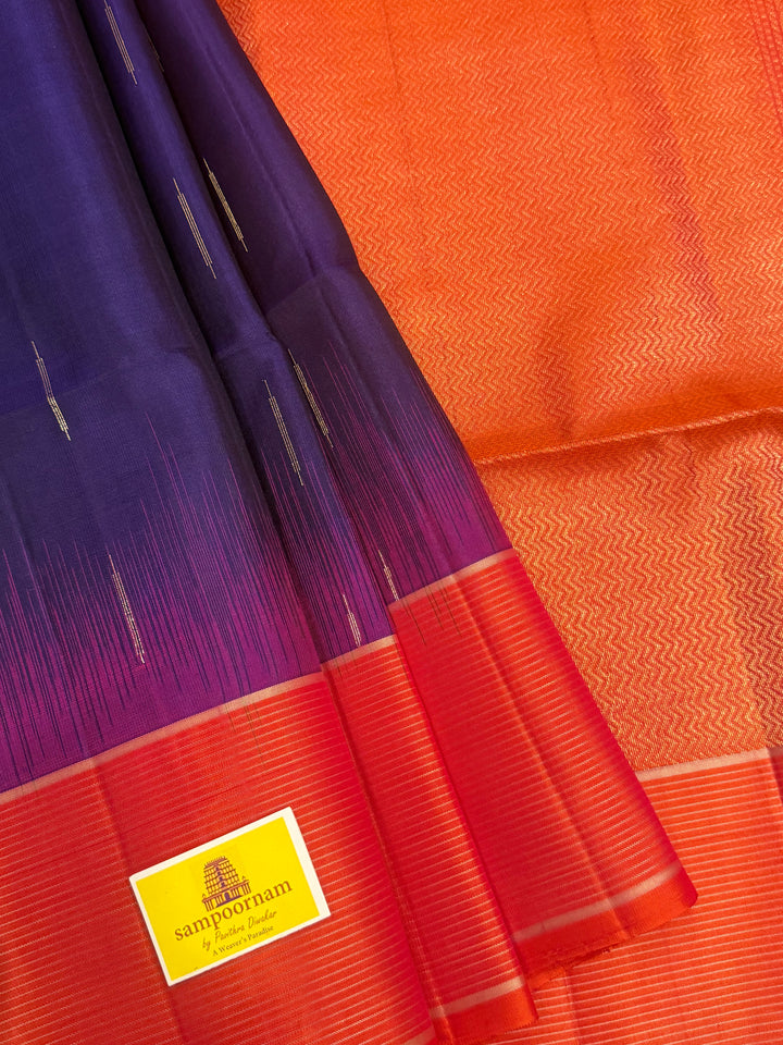 Indigo Blue with Orangish Pink raindrop zari motif in the body , vairaoosi borders and rich Pallu , pure soft silk saree