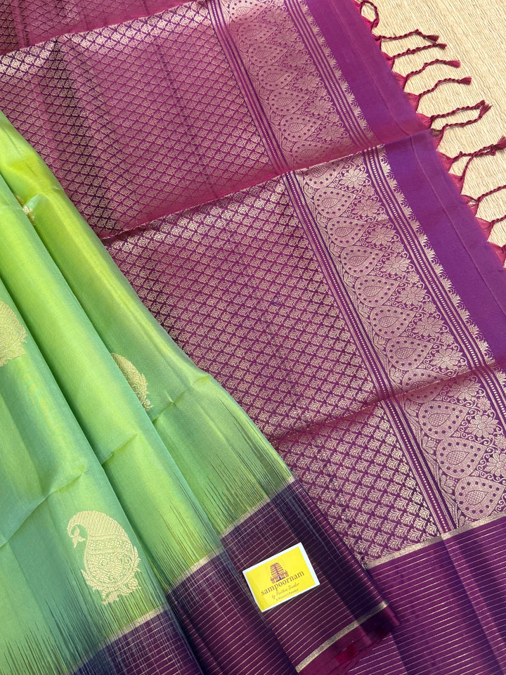 Pastel Green with Purple , rich mango Zari butta in the body , vairaoosi lines in the border and grand  Pallu , pure soft silk saree