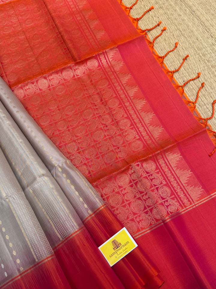 Offwhite with Orangish Pink , rich silver and gold Zari butta in the body , grand Pallu  pure soft silk saree
