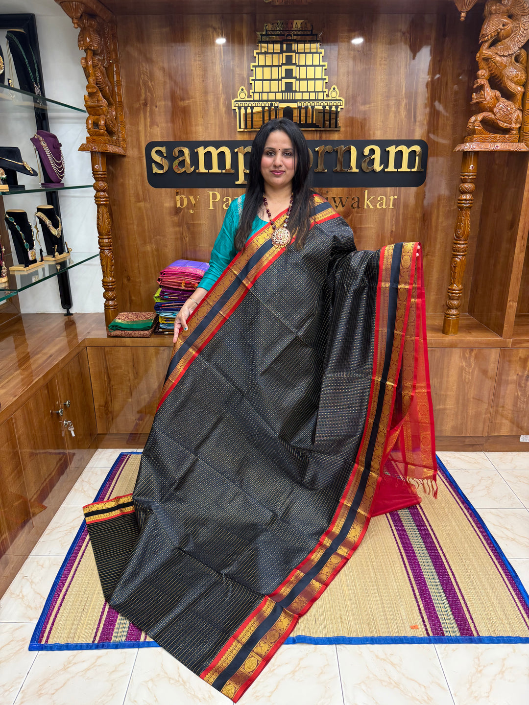 Dark Blue with Red , Zari  butta in the body , rettapet border and rich Pallu Lakshadeepam Silk Cotton Saree