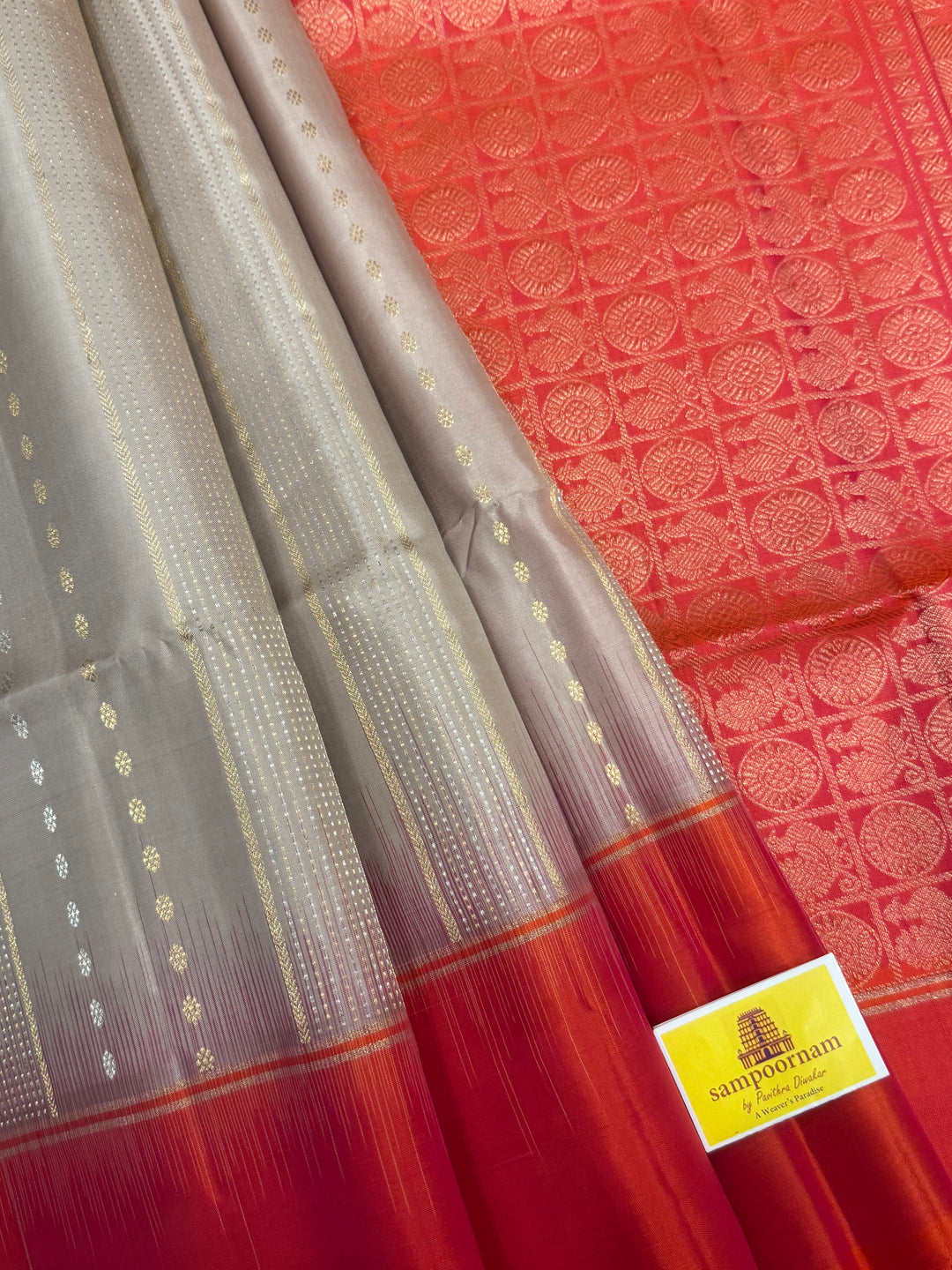 Offwhite with Orangish Pink , rich silver and gold Zari butta in the body , grand Pallu  pure soft silk saree