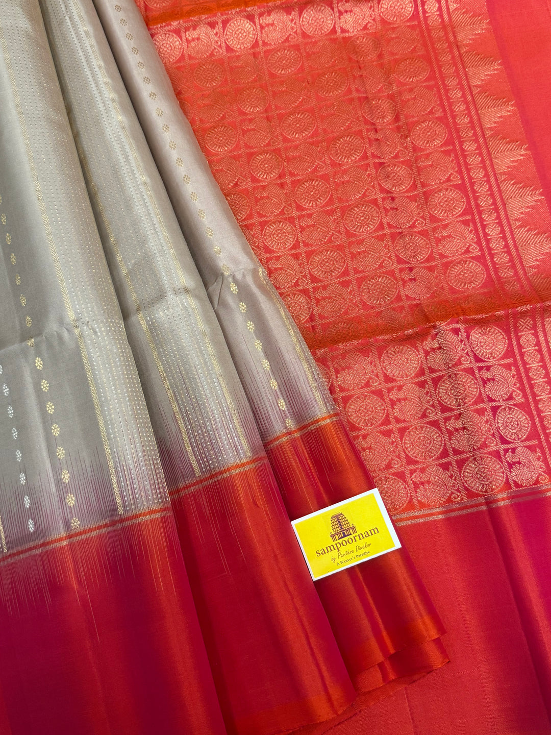 Offwhite with Orangish Pink , rich silver and gold Zari butta in the body , grand Pallu  pure soft silk saree