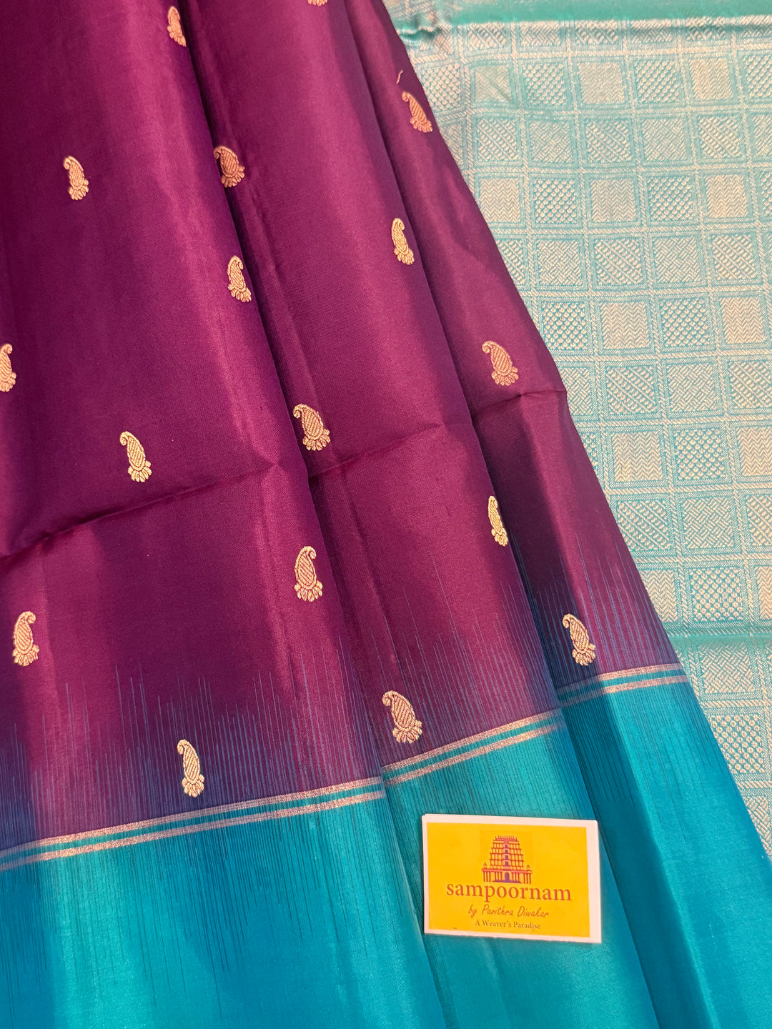 Purple with Turquoise Blue , Mango zari motif in the body , plain borders and rich Pallu , pure soft silk saree