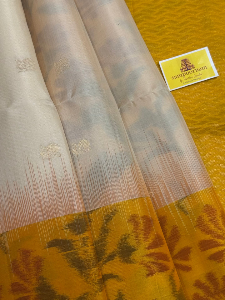 Offwhite with Yellow , Pochampally borders and blouse , Zari Mayil butta in the body and rich Pallu , pure soft silk saree