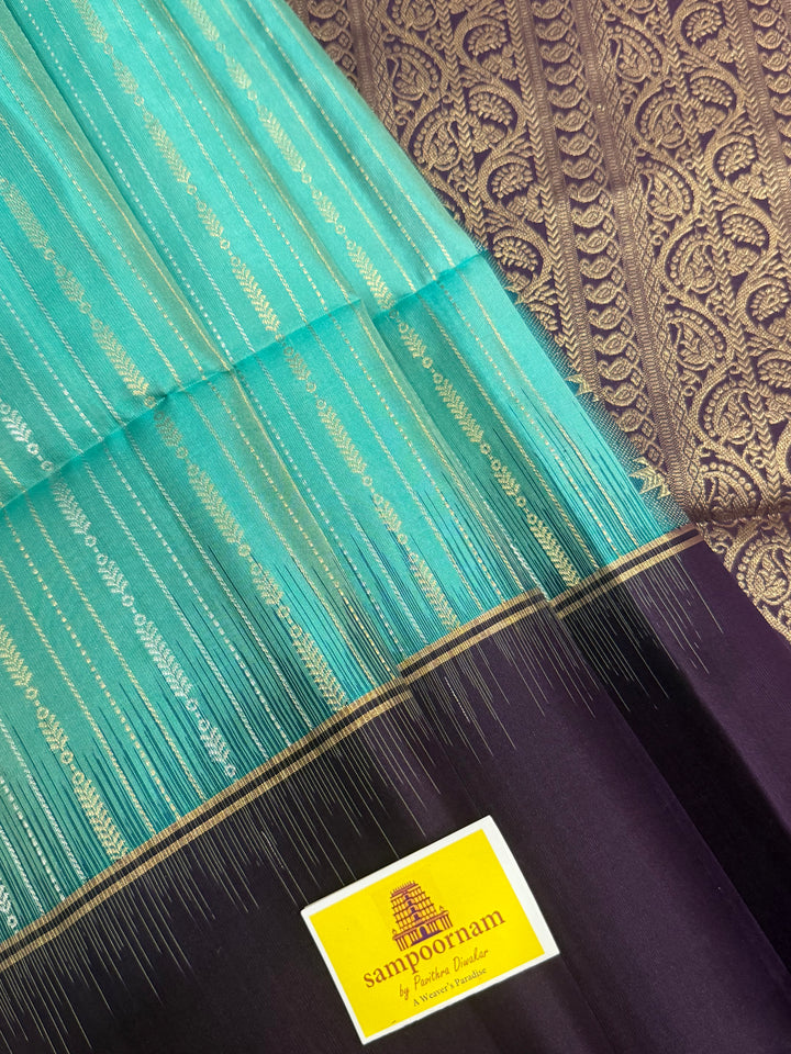 Pastel Light Blue with Purple , rich zari gold and silver zari butta in the body and grand  Pallu , pure soft silk saree