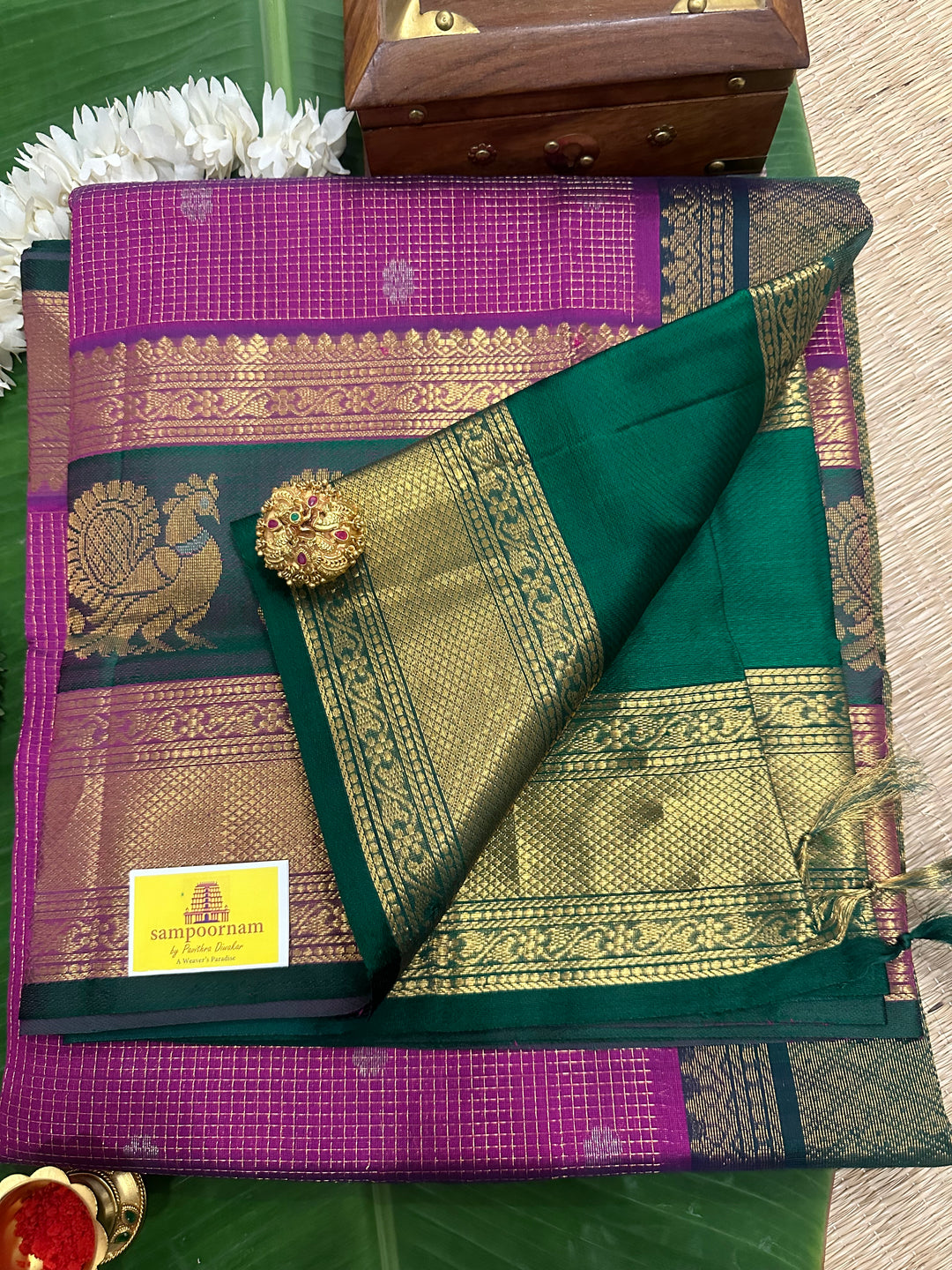 Purple with Dark Green One Side Big Satin Border with Annam Motifs ,Podi Zari Kattam with Silver Buttas in the Body ,  Rich Pallu Korvai Silk Cotton Saree