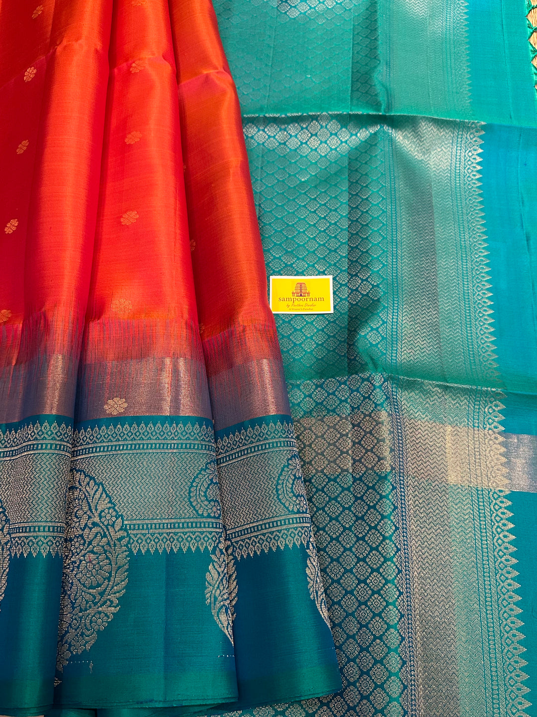 Brick Orange with Turquoise Blue , One Side Big Border , Annam and Flower Zari Motif in the Body and Rich Pallu  Pure Soft Silk Saree