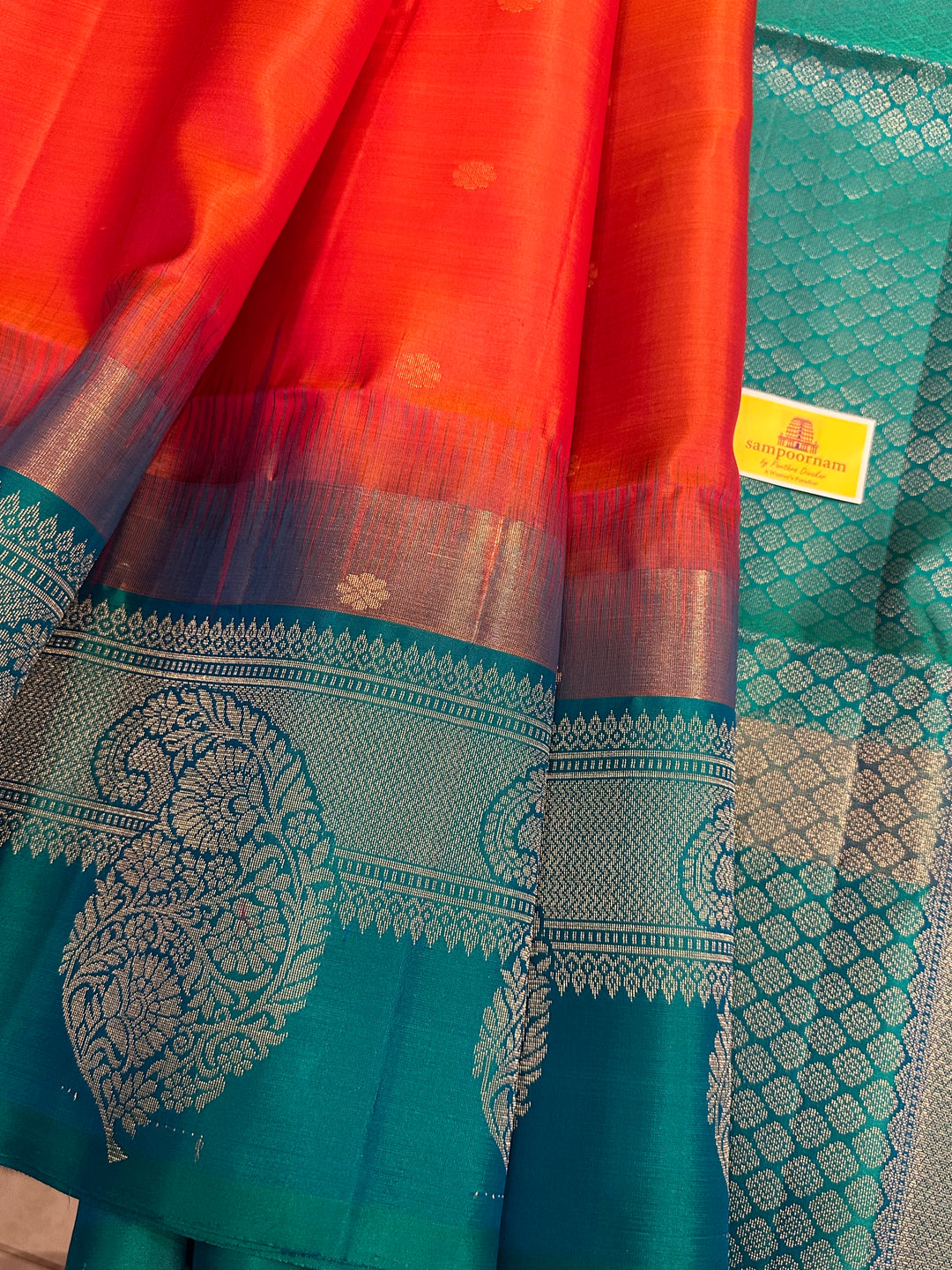 Brick Orange with Turquoise Blue , One Side Big Border , Annam and Flower Zari Motif in the Body and Rich Pallu  Pure Soft Silk Saree