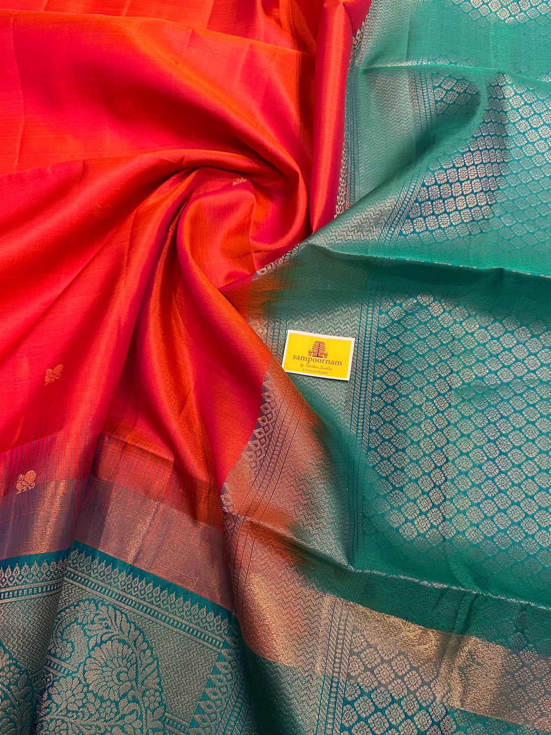 Brick Orange with Turquoise Blue , One Side Big Border , Annam and Flower Zari Motif in the Body and Rich Pallu  Pure Soft Silk Saree