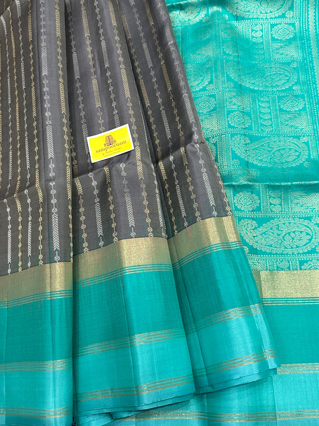 Grey With Sea Green Triple Border, Gold And Silver Zari Lines all over the body And Rich Pallu  Pure Soft Silk Saree