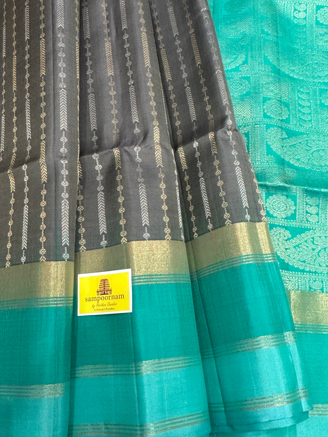 Grey With Sea Green Triple Border, Gold And Silver Zari Lines all over the body And Rich Pallu  Pure Soft Silk Saree