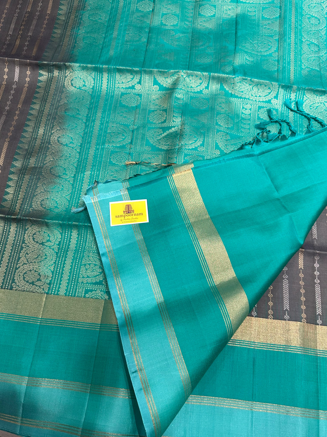 Grey With Sea Green Triple Border, Gold And Silver Zari Lines all over the body And Rich Pallu  Pure Soft Silk Saree