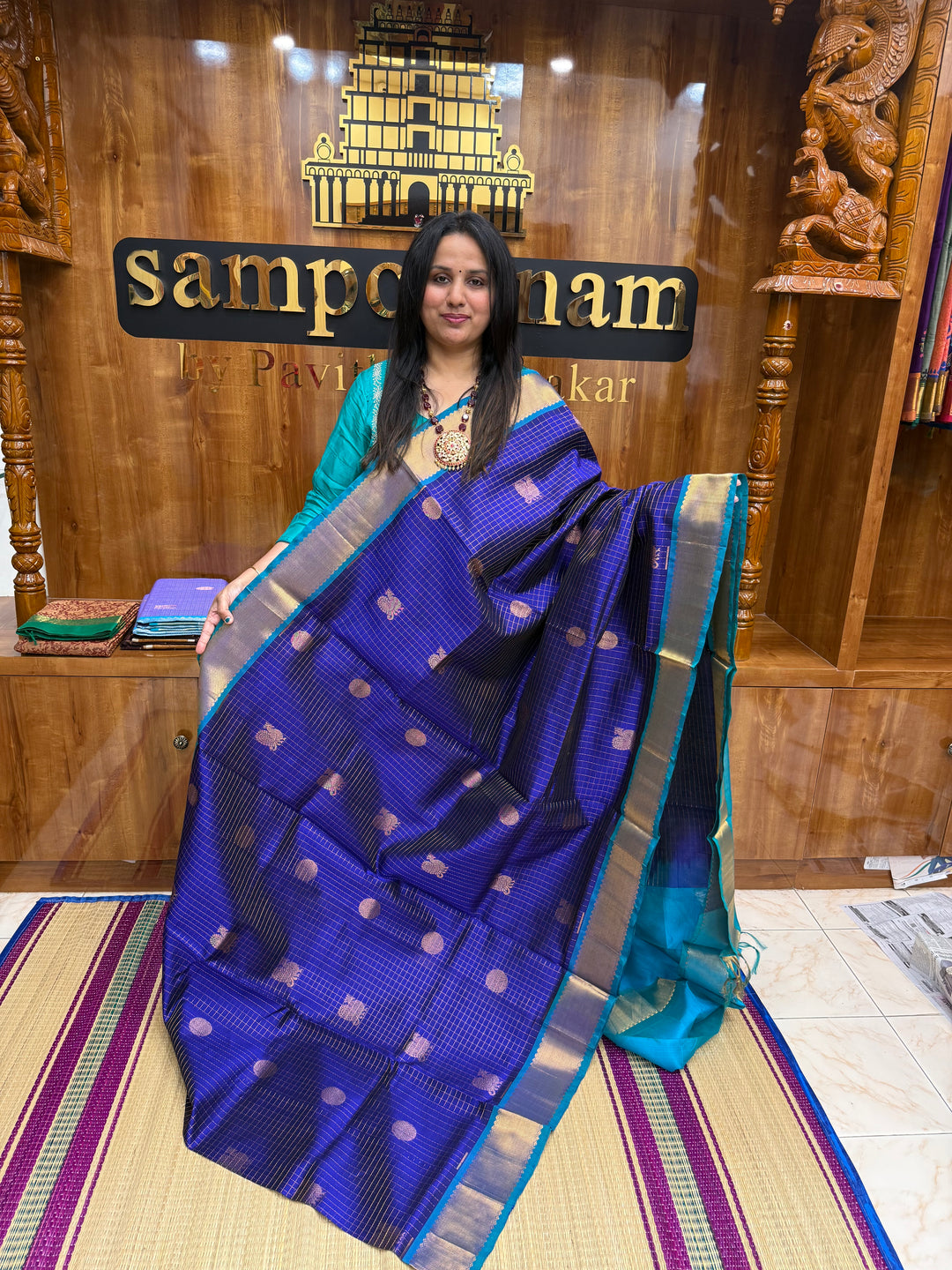 Blue with Turquoise Blue , Zari Checks with  Mayil and  Chakram Butta in the Body, Traditional Borders and Rich Pallu Mayil Chakram Silk Cotton Saree