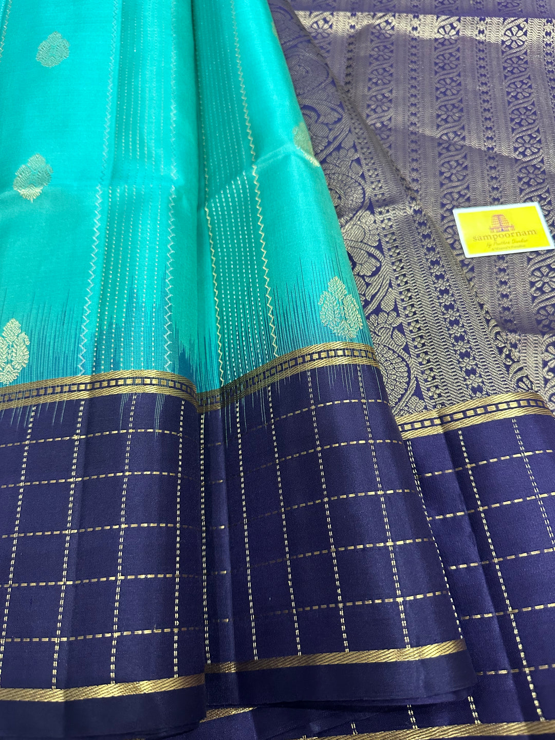 Light Greenish Blue with Dark Blue ,Zari Checks In the Border , Silver and Gold Zari Lines in the Body and Rich Pallu, Pure Soft Silk Saree