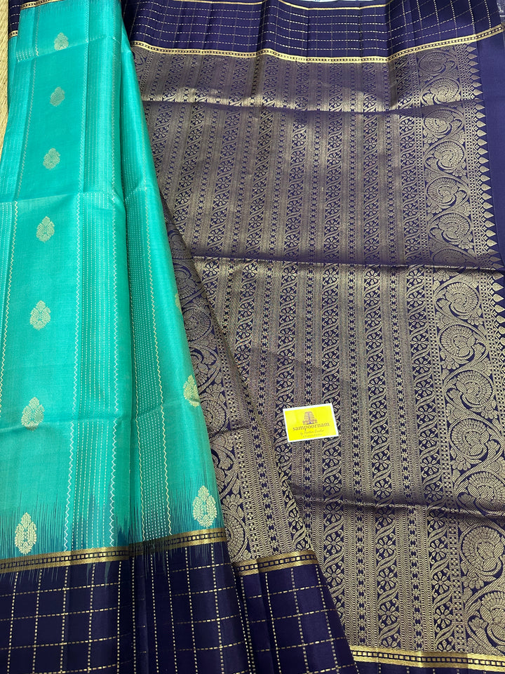 Light Greenish Blue with Dark Blue ,Zari Checks In the Border , Silver and Gold Zari Lines in the Body and Rich Pallu, Pure Soft Silk Saree