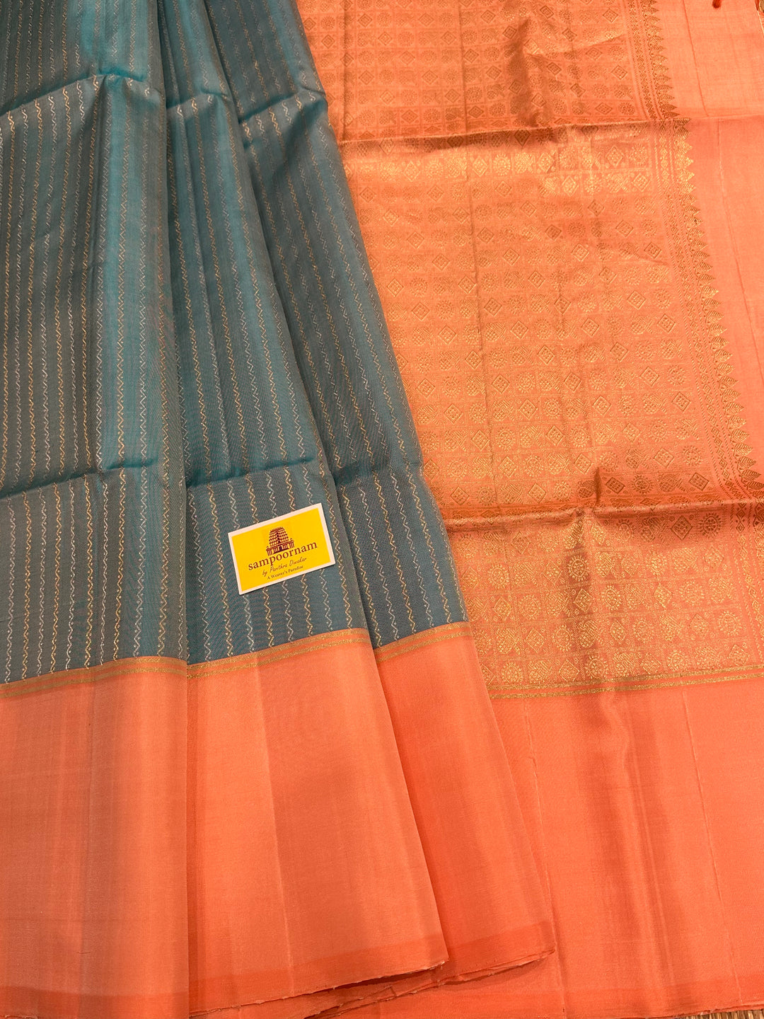 Light Blue with Pastel Orangish Pink Silver and Gold Zari Lines in the Body and Rich Zari Pallu Pure Soft Silk Saree