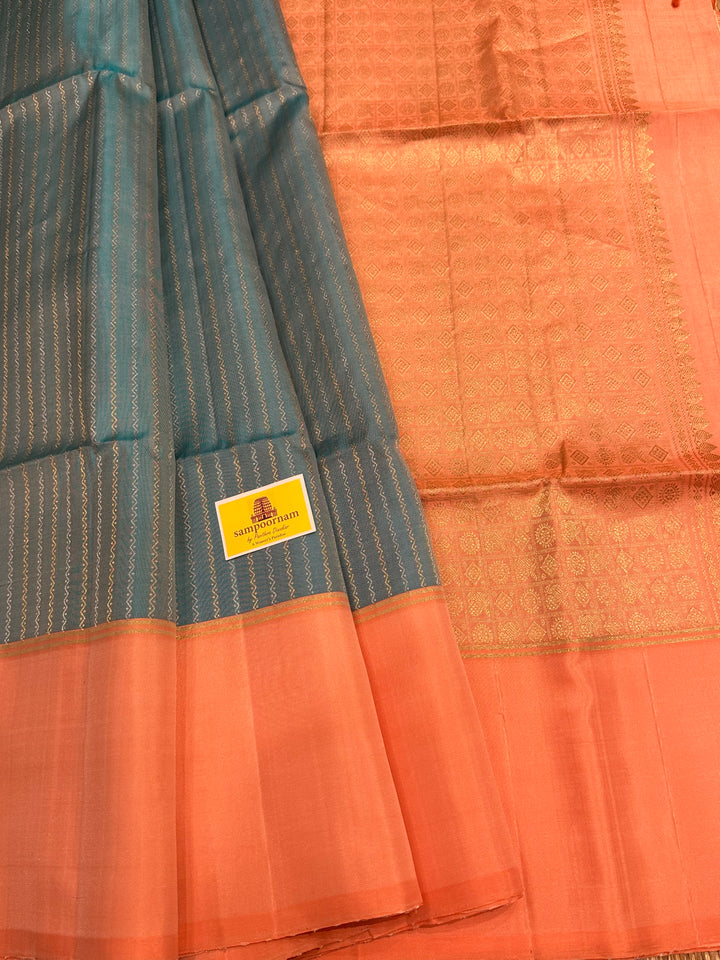 Light Blue with Pastel Orangish Pink Silver and Gold Zari Lines in the Body and Rich Zari Pallu Pure Soft Silk Saree