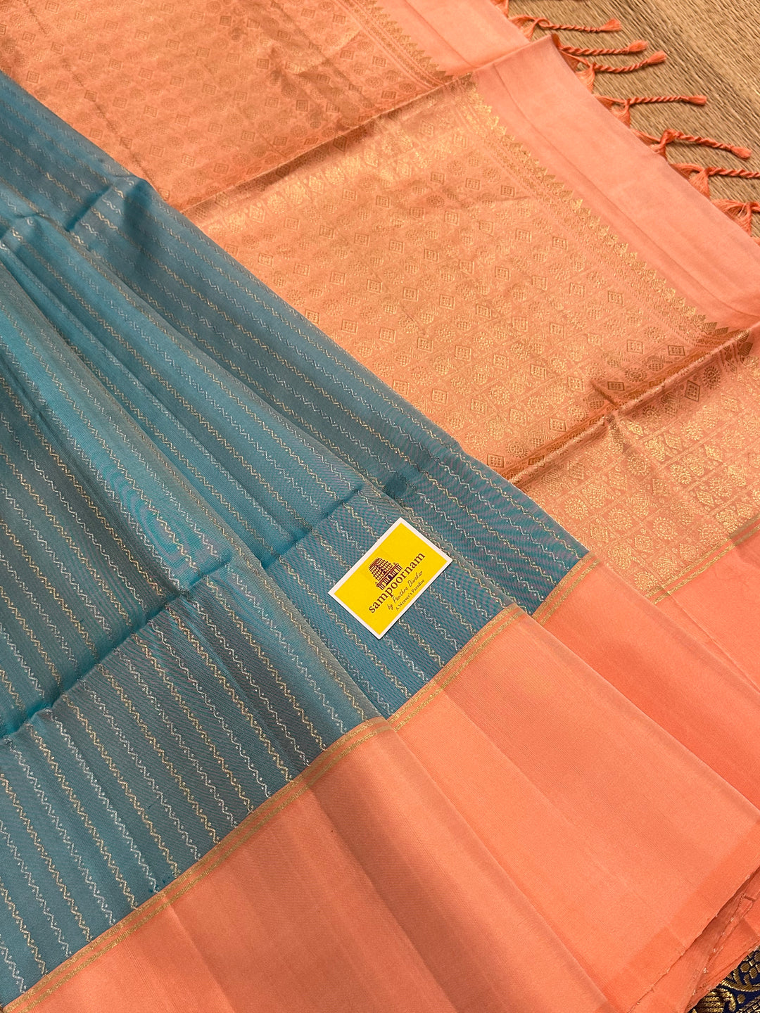 Light Blue with Pastel Orangish Pink Silver and Gold Zari Lines in the Body and Rich Zari Pallu Pure Soft Silk Saree