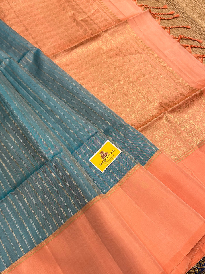 Light Blue with Pastel Orangish Pink Silver and Gold Zari Lines in the Body and Rich Zari Pallu Pure Soft Silk Saree