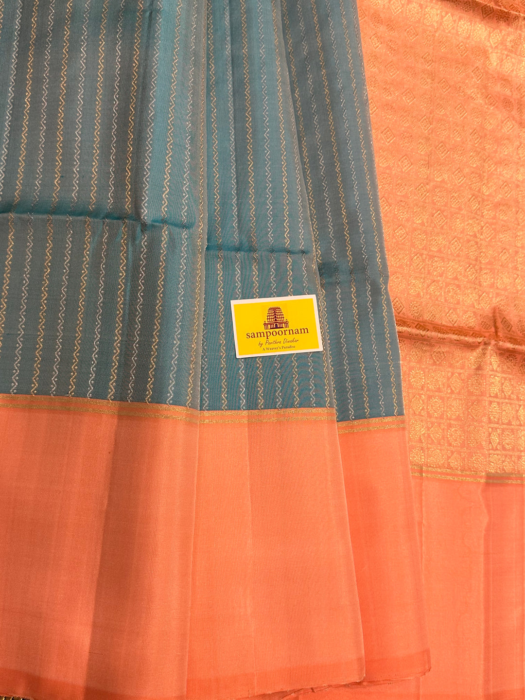 Light Blue with Pastel Orangish Pink Silver and Gold Zari Lines in the Body and Rich Zari Pallu Pure Soft Silk Saree