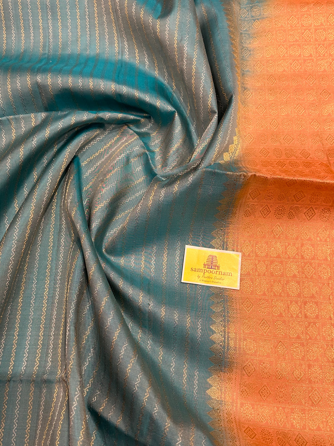 Light Blue with Pastel Orangish Pink Silver and Gold Zari Lines in the Body and Rich Zari Pallu Pure Soft Silk Saree