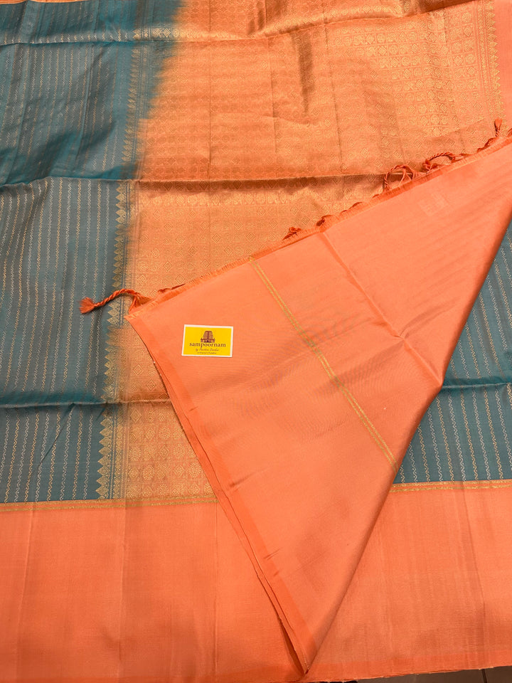 Light Blue with Pastel Orangish Pink Silver and Gold Zari Lines in the Body and Rich Zari Pallu Pure Soft Silk Saree