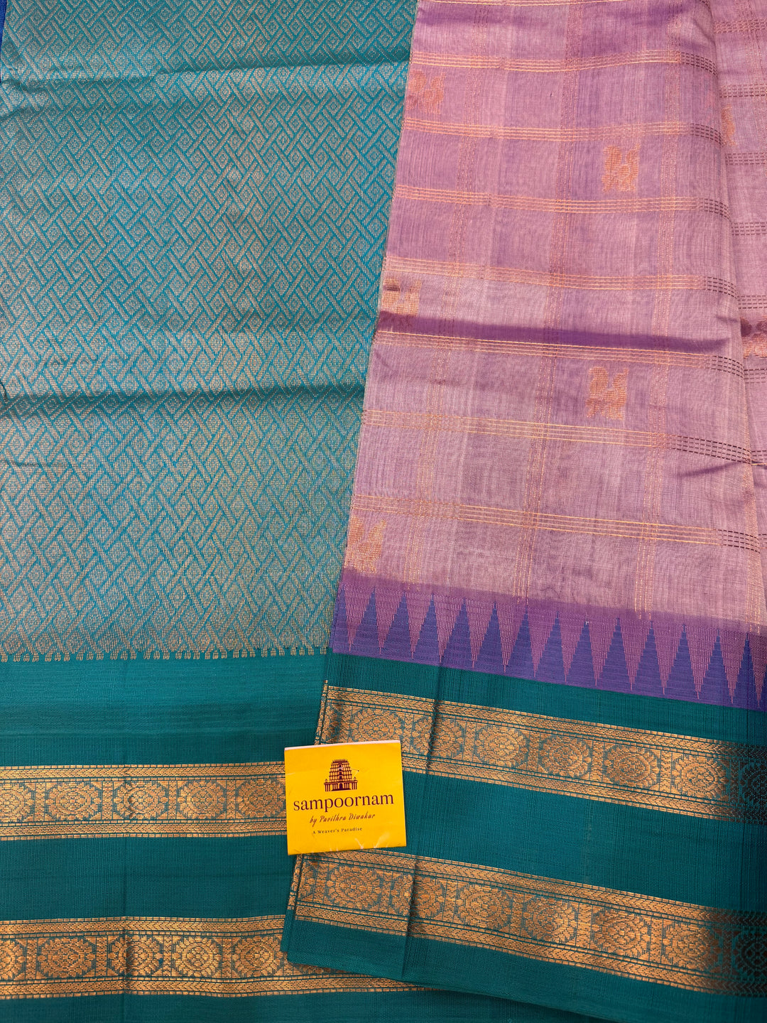 Lilac with Turquoise Blue , Zari Checks with Mayil and Chakram rich Butta  in the body and rettapet border , rich Pallu Korvai Silk Cotton Saree