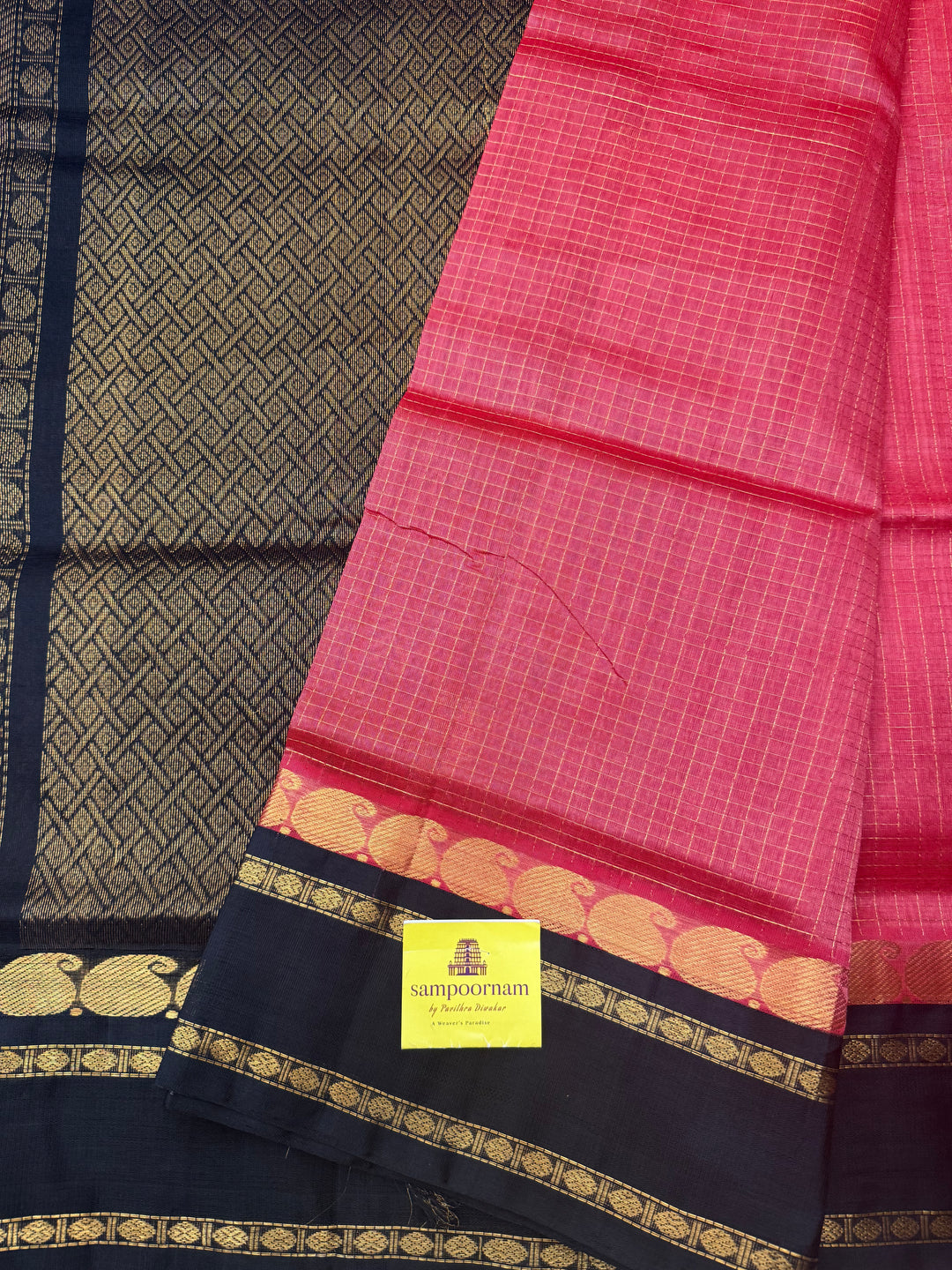 Dark Keva with Black , Zari Checks with rich Mayil and Chakram Butta in the body and rettapet border , rich Pallu Korvai Silk Cotton Saree