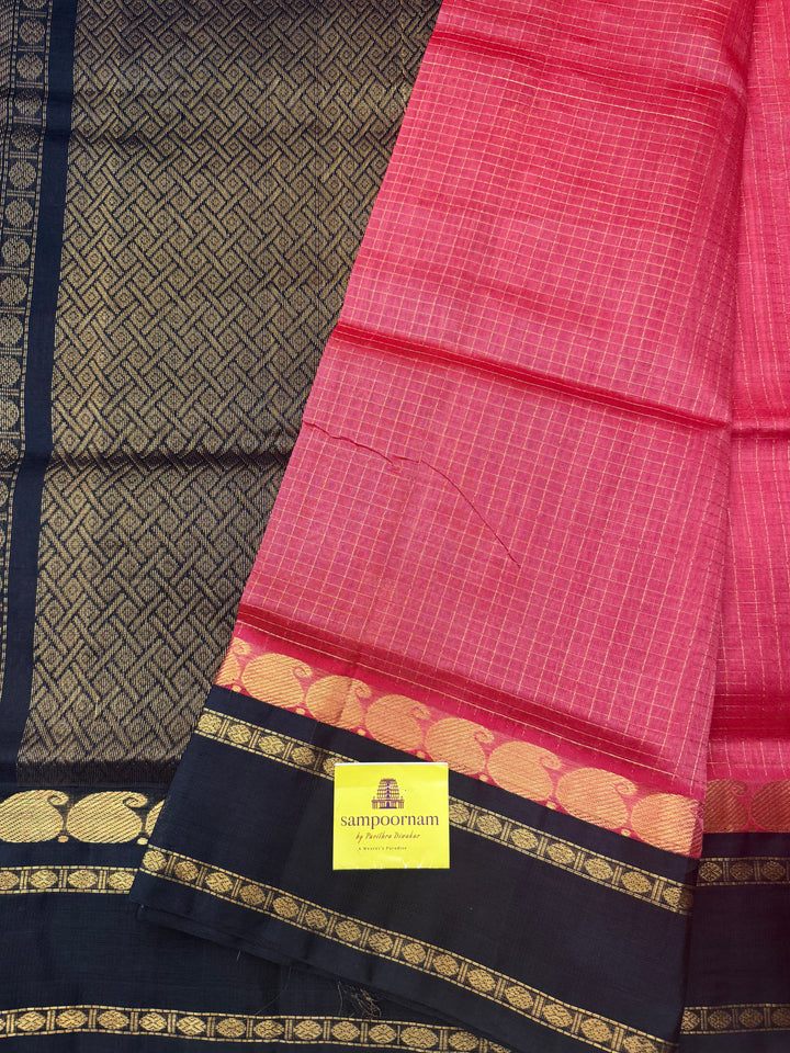 Dark Keva with Black , Zari Checks with rich Mayil and Chakram Butta in the body and rettapet border , rich Pallu Korvai Silk Cotton Saree