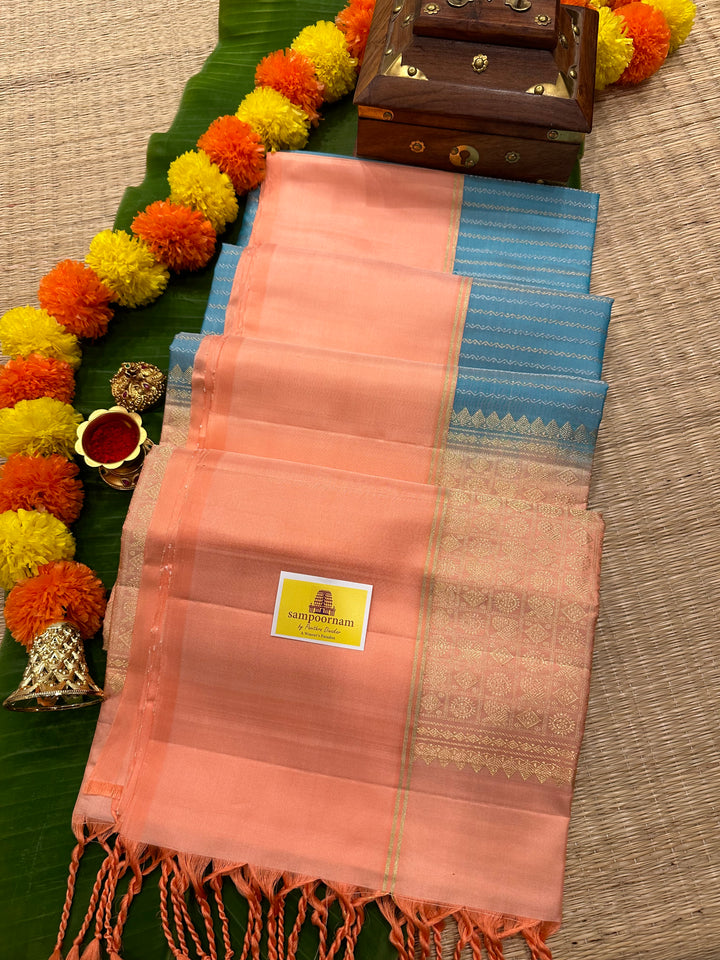 Light Blue with Pastel Orangish Pink Silver and Gold Zari Lines in the Body and Rich Zari Pallu Pure Soft Silk Saree