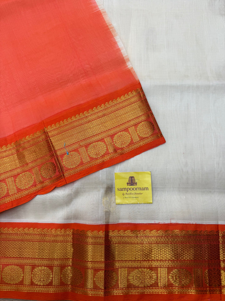 Offwhite with Orange , rich Floral Zari butta in the body and Traditional Borders , rich Pallu Korvai Silk Cotton Saree