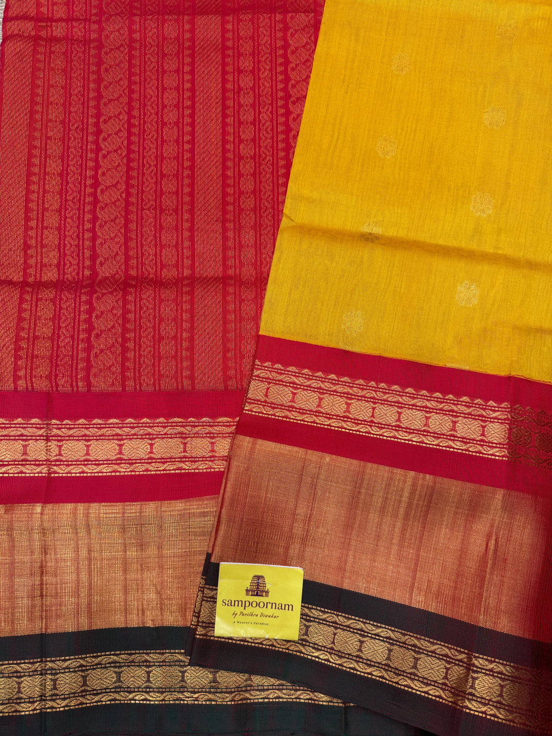 Manjal with Red , rich Floral Zari butta in the body  and One side Triple  Borders , rich Pallu Korvai Silk Cotton Saree