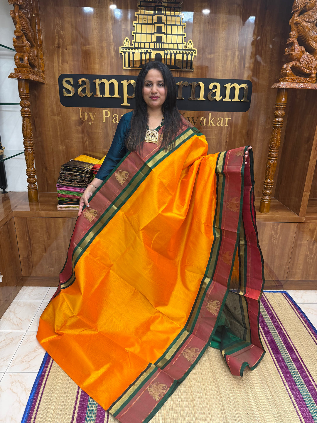 Mambazha Manjal with Green , Elephant motifs in the borders and Traditional Pallu Korvai Silk Cotton Saree