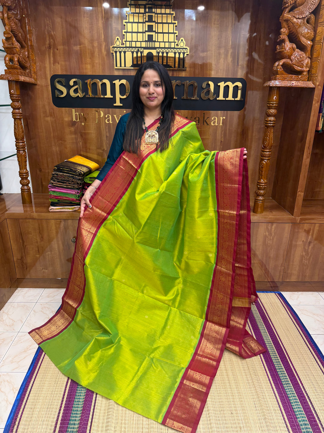 Parrot Green with Red , rich  Zari butta in the body and Traditional Borders , rich Pallu Korvai Silk Cotton Saree