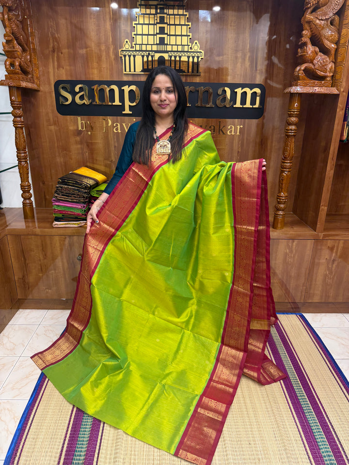 Parrot Green with Red , rich  Zari butta in the body and Traditional Borders , rich Pallu Korvai Silk Cotton Saree