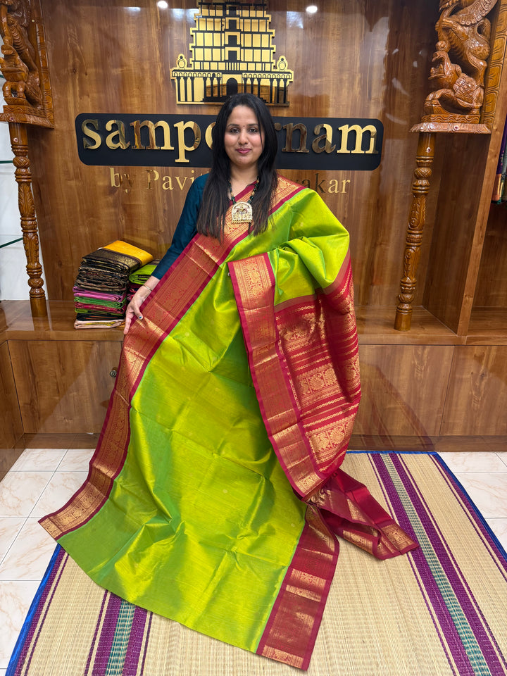 Parrot Green with Red , rich  Zari butta in the body and Traditional Borders , rich Pallu Korvai Silk Cotton Saree