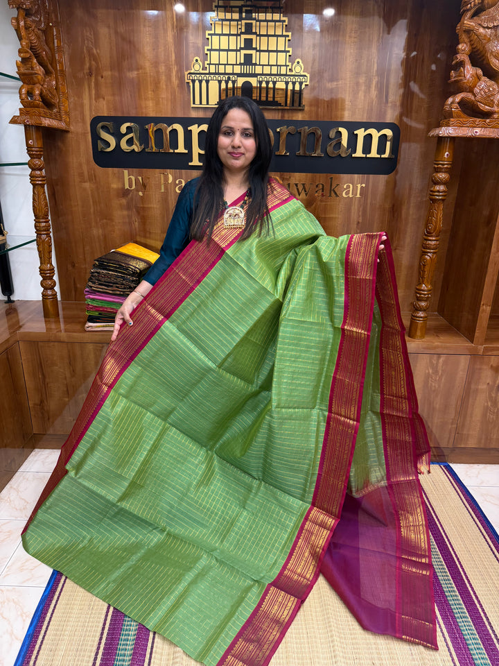 Green with Magenta , Zari Checks in the body and Traditional  border , rich Pallu Korvai Silk Cotton Saree
