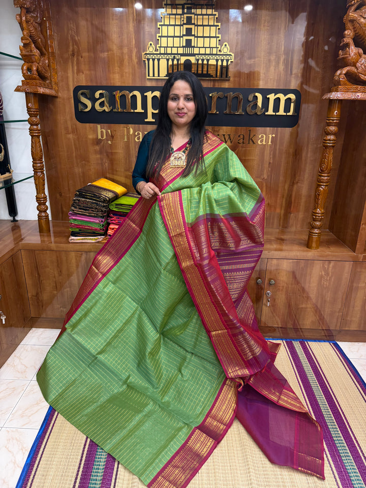 Green with Magenta , Zari Checks in the body and Traditional  border , rich Pallu Korvai Silk Cotton Saree