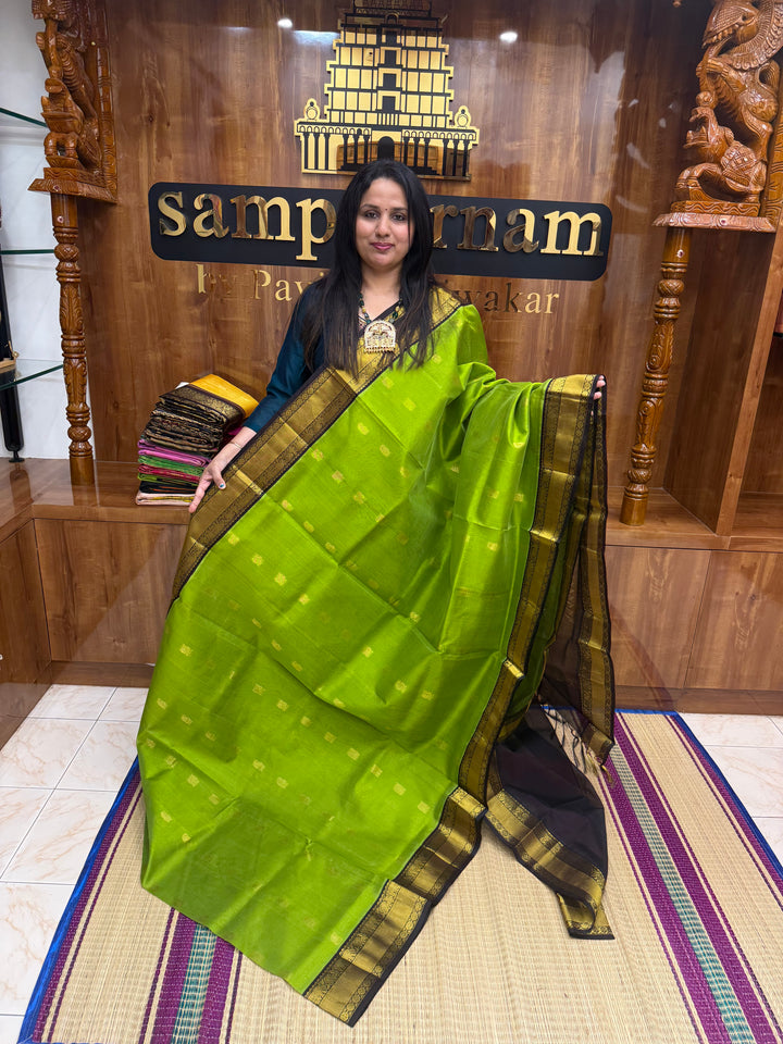 Leaf  Green with Dark Brown , rich Mango Zari butta in the body and Traditional Silk Borders , rich Pallu Korvai Silk Cotton Saree