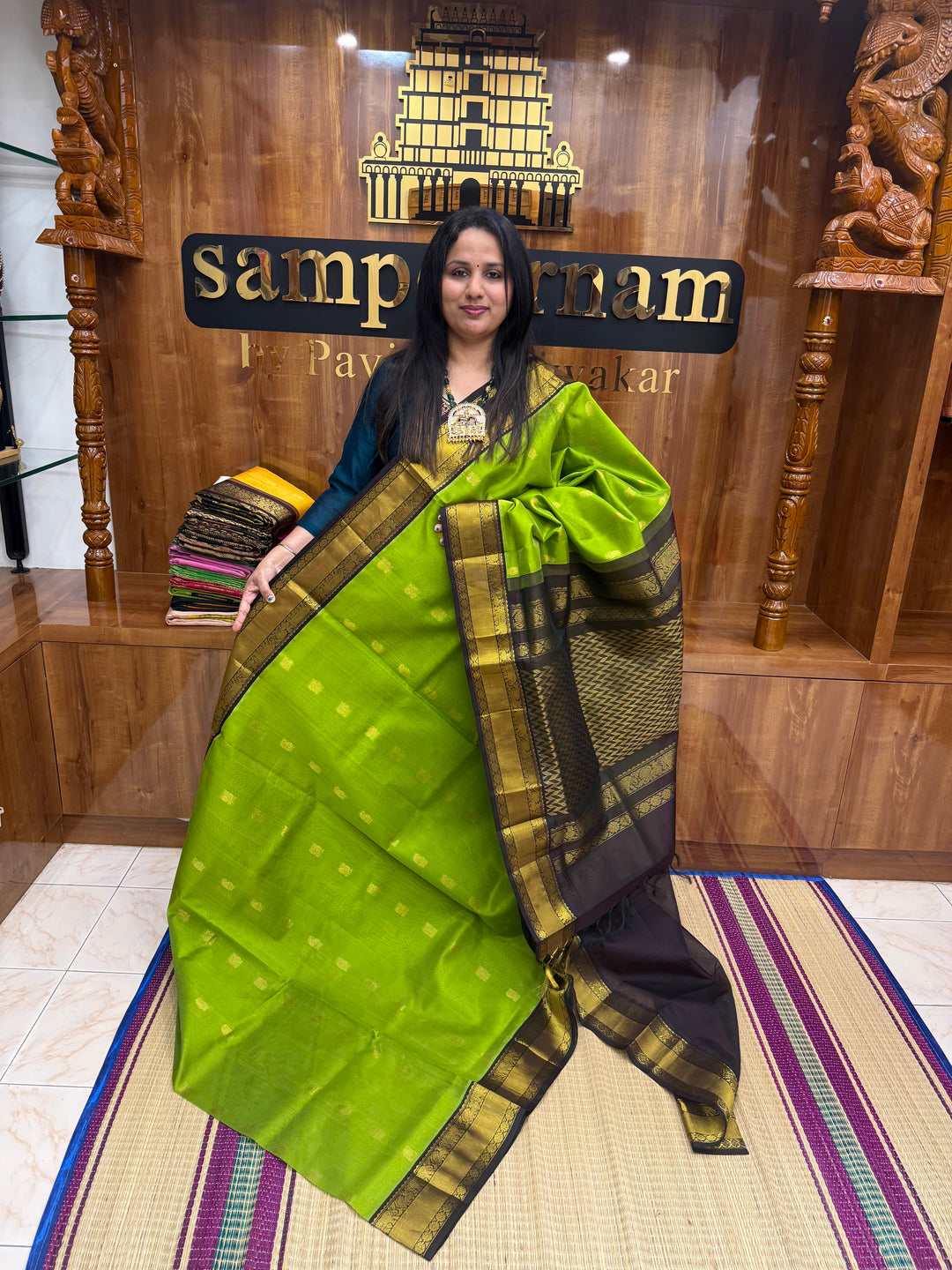 Leaf  Green with Dark Brown , rich Mango Zari butta in the body and Traditional Silk Borders , rich Pallu Korvai Silk Cotton Saree