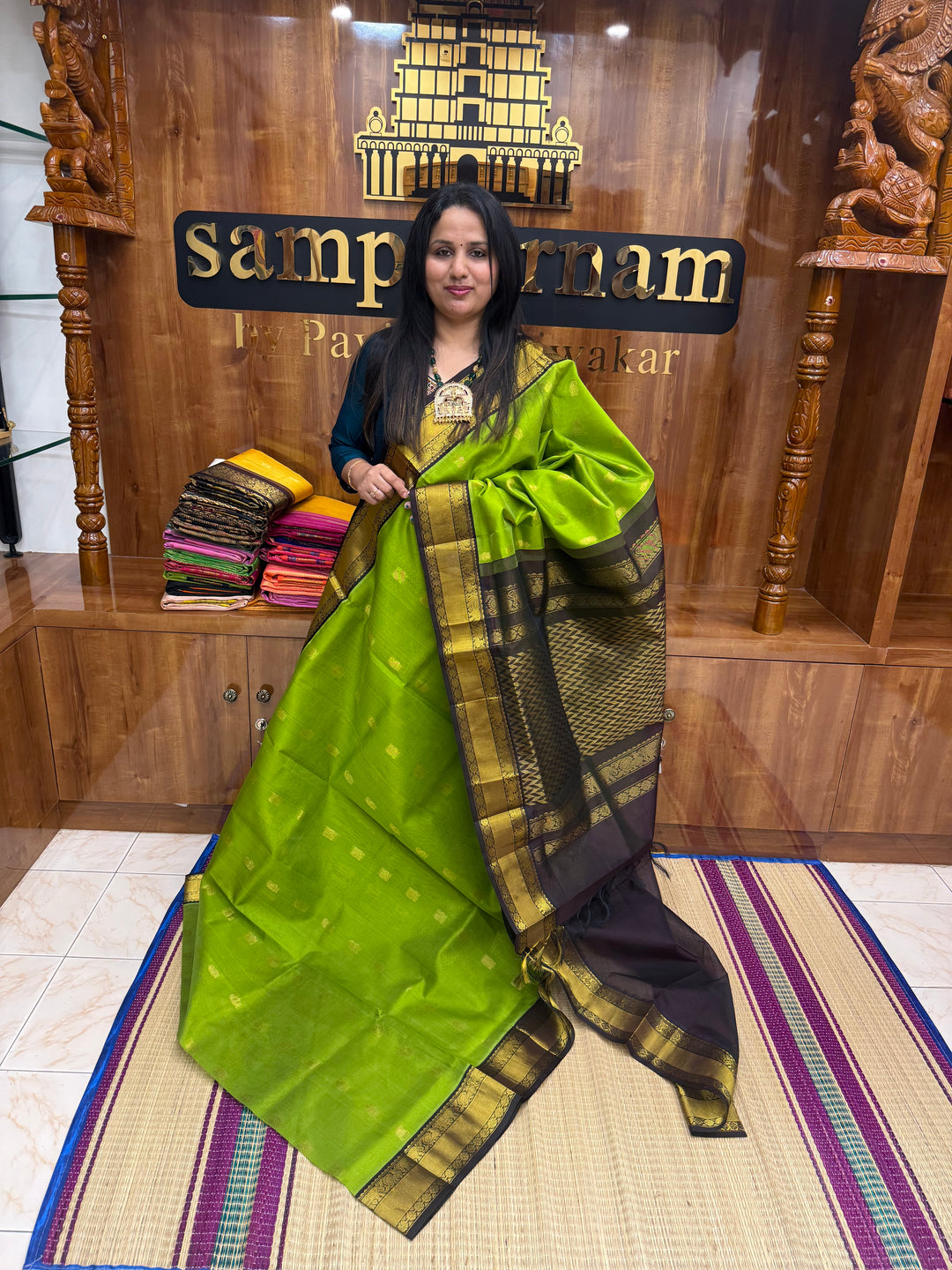 Leaf  Green with Dark Brown , rich Mango Zari butta in the body and Traditional Silk Borders , rich Pallu Korvai Silk Cotton Saree