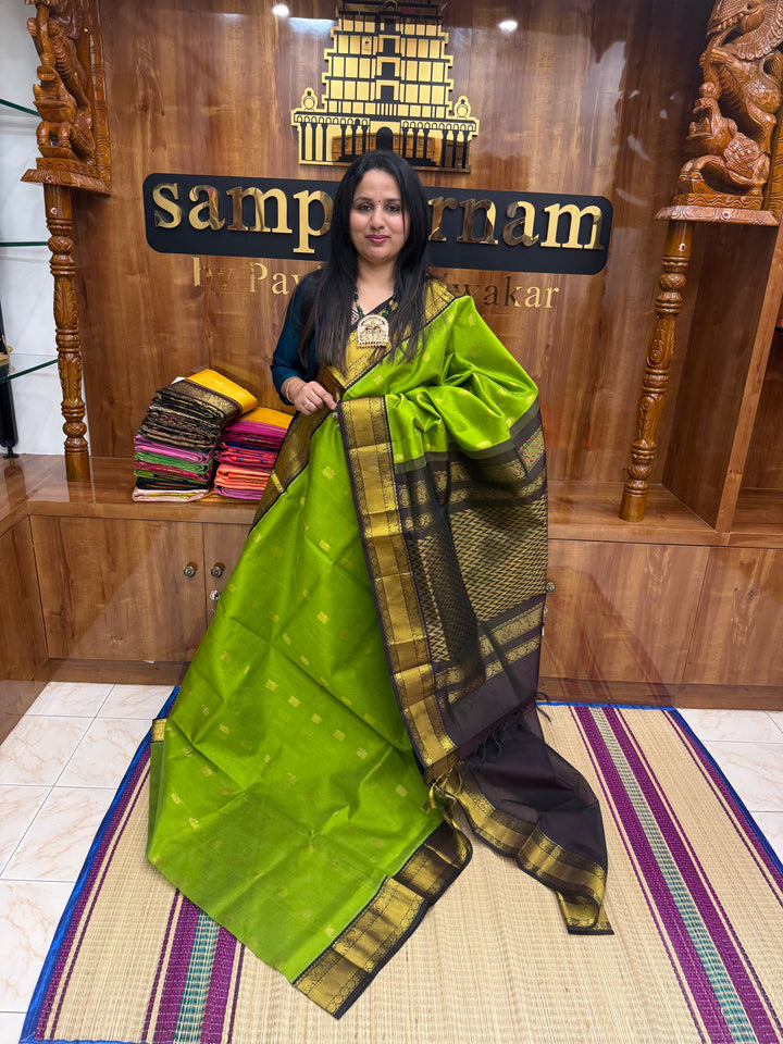 Leaf  Green with Dark Brown , rich Mango Zari butta in the body and Traditional Silk Borders , rich Pallu Korvai Silk Cotton Saree