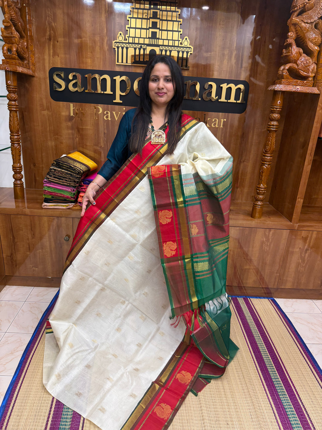Offwhite with Green ,  rich Annam  Zari butta in the body  and  Annam  Borders , rich Pallu Korvai Silk Cotton Saree