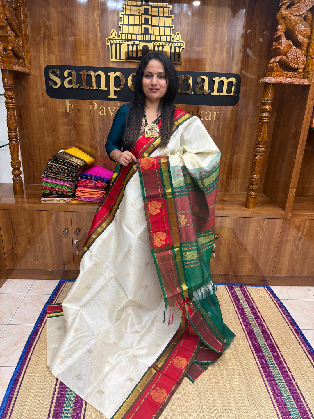 Offwhite with Green ,  rich Annam  Zari butta in the body  and  Annam  Borders , rich Pallu Korvai Silk Cotton Saree