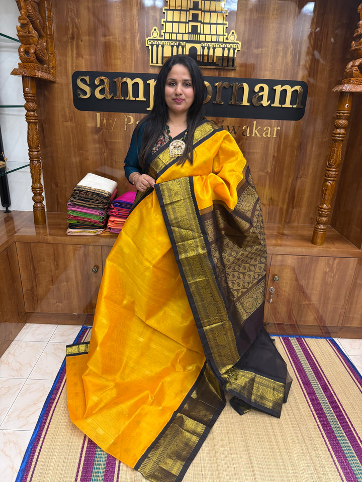 Mambazha Manjal with Brown , rich Lotus  Zari butta in the body and Traditional Borders , rich Pallu Korvai Silk Cotton Saree